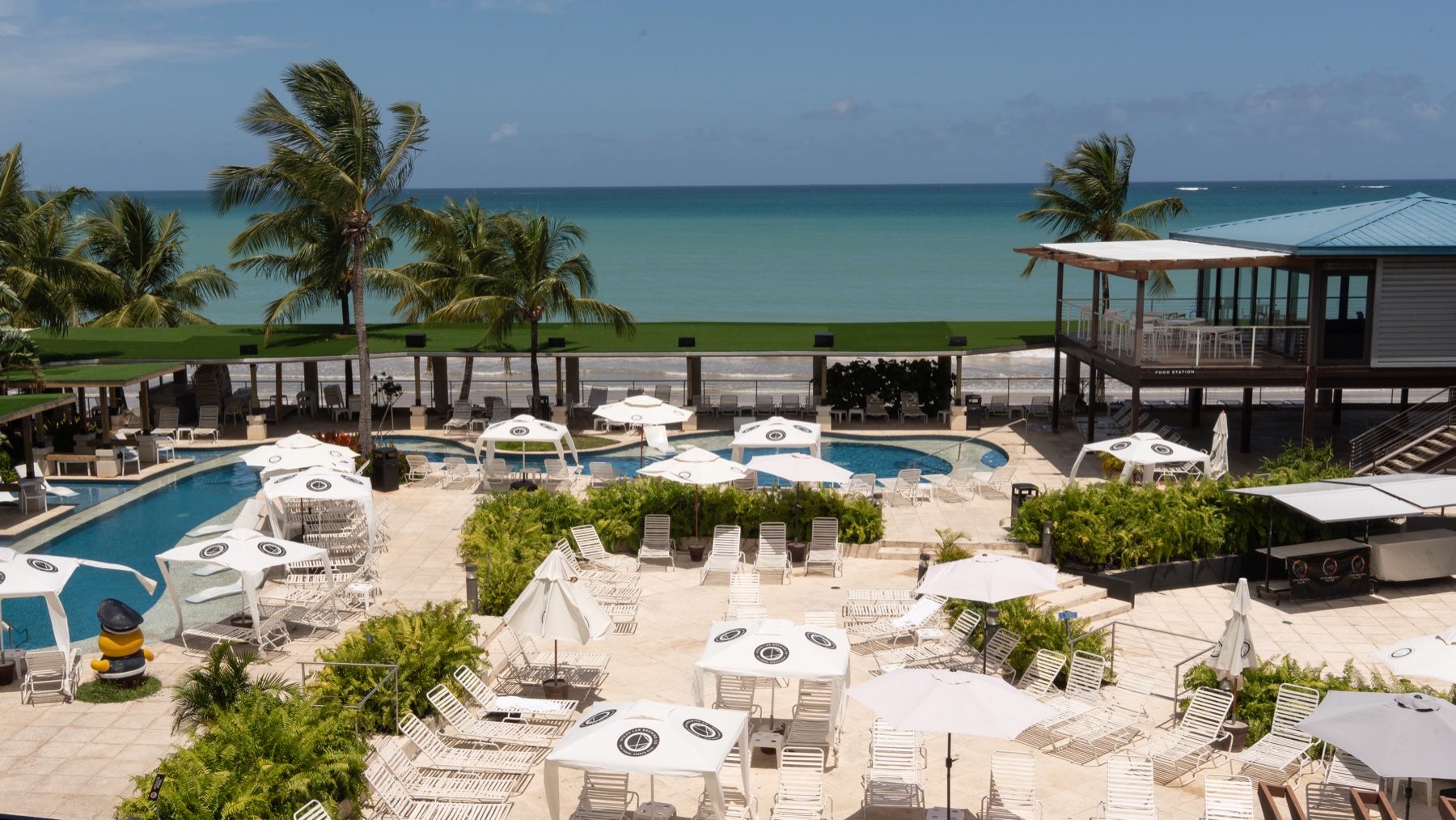 Vivo Beach Club pool deck overlooking Isla Verde beach